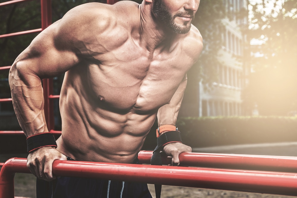 Muscular Man During His Workout On The Street