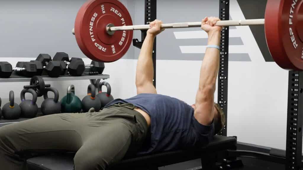 a man doing close grip bench press