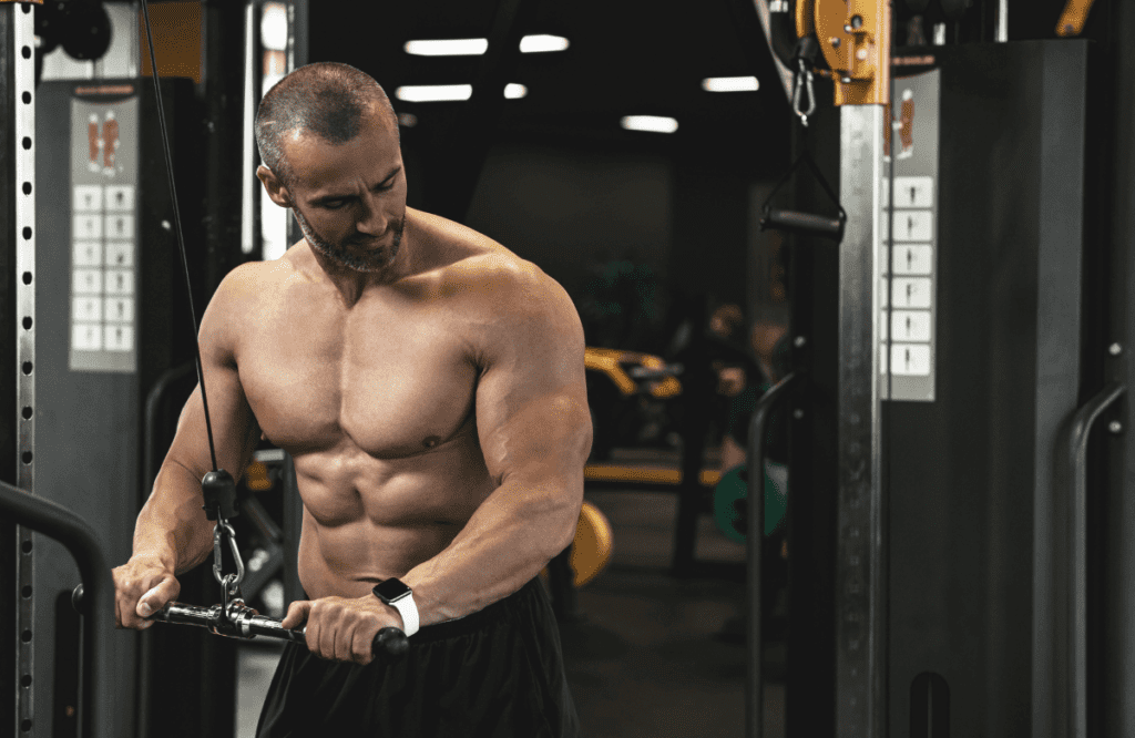 a man doing Tricep Pushdown in a gym