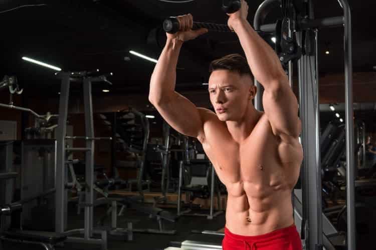 a man exercising Extension of Single Arm Overhead Cable