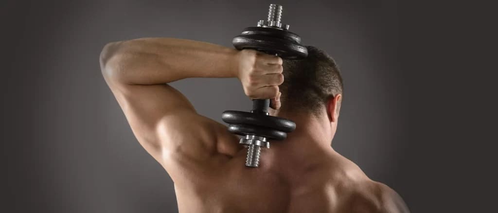 a man with a dumbell holding in his hand