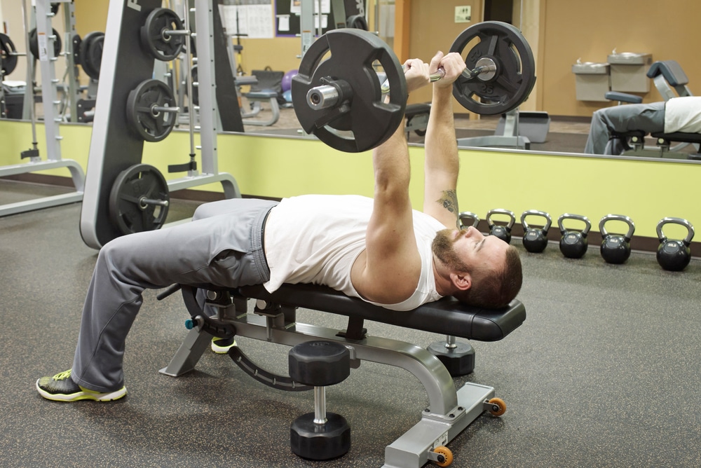  man doing crushers of the skull 