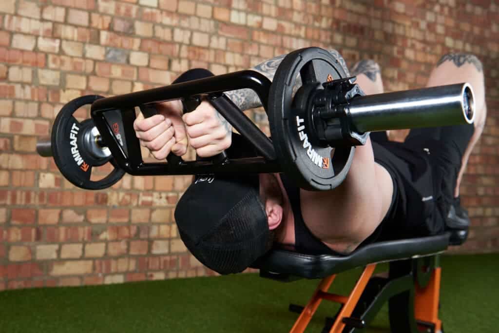 man doing Barbell Tricep Extension Overhead