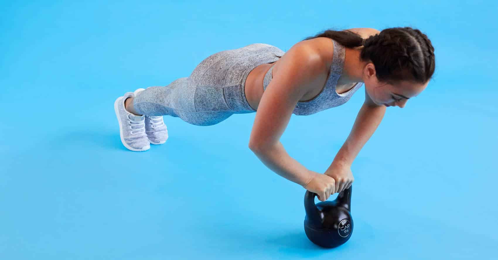 a women doing Kettlebell Push Ups exerise