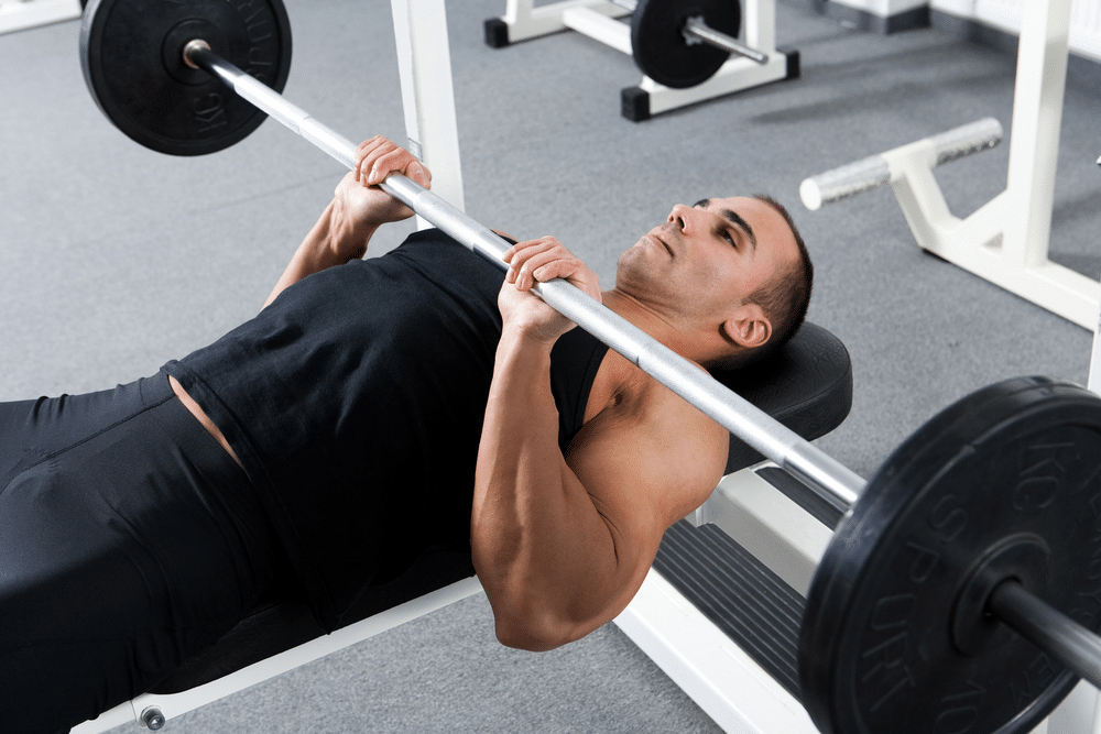 man doing bench press exercise 